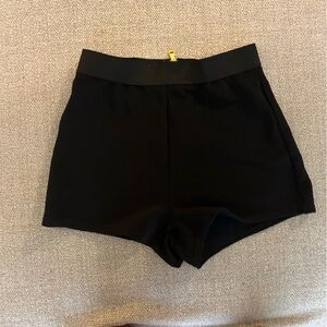 black shorts with gold zipper